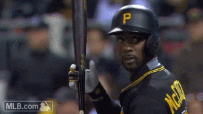 Baseball Player with P Helmet Holding Bat