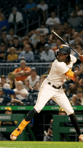 Baseball Player with P on Helmet Swings at Pitch