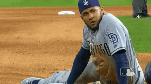 Baseball Player with S on Hat Stretching
