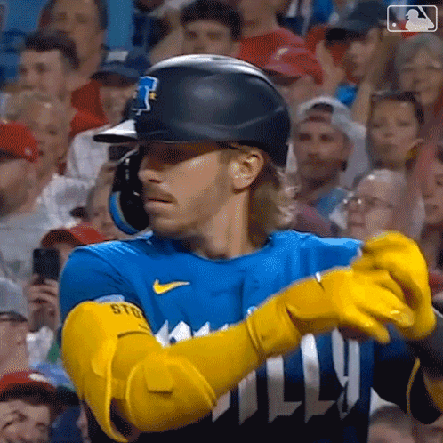 Baseball Player With Yellow Gloves And Helmet Facing Crowd GIF