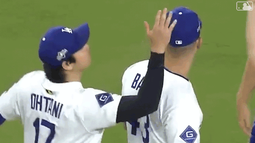 Baseball Players High Five On Field GIF