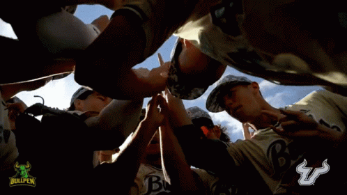 Baseball Players Huddle With Bullpen Logo