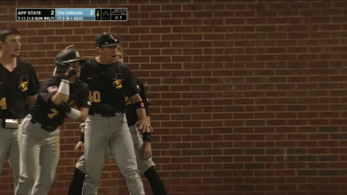Baseball Players Huddled With Number 40