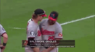 Baseball Players Hugging on Field