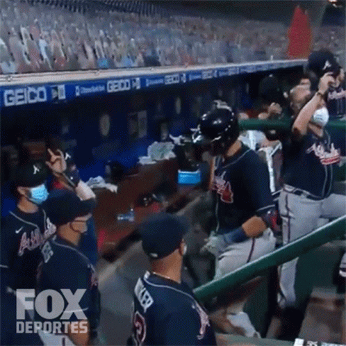 Baseball Players in Dugout with Fox Deportes