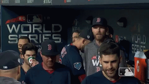Baseball Players In Front Of World Series Wall GIF