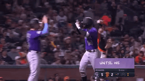 Baseball Players in Purple Colorado Uniforms
