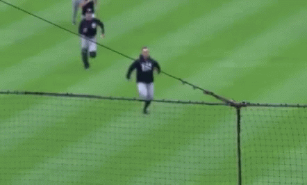 Baseball Players Running on Field
