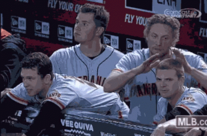 Baseball Players Sitting in Dugout