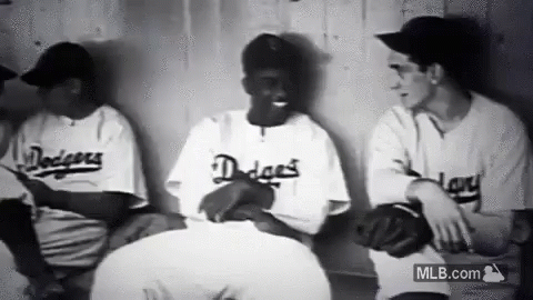 Baseball Players Sitting in Dugout Talking