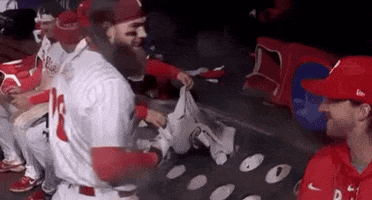 Baseball Players Sitting In Dugout GIF