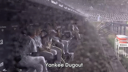 Baseball Players Sitting in Dugout