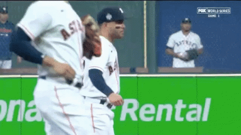 Baseball Players Standing Next To Rental Sign GIF