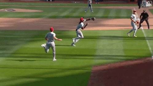 Baseball Players Standing On Field GIF
