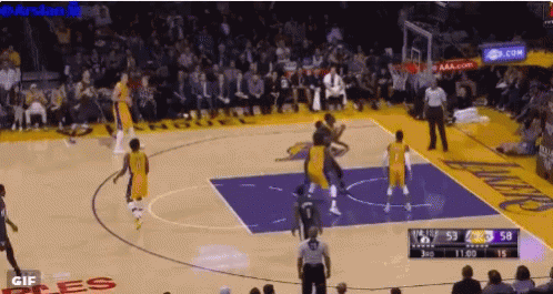 Basketball Game in Front of Crowd