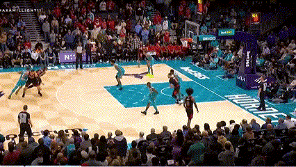 Basketball Game in Front of Crowd