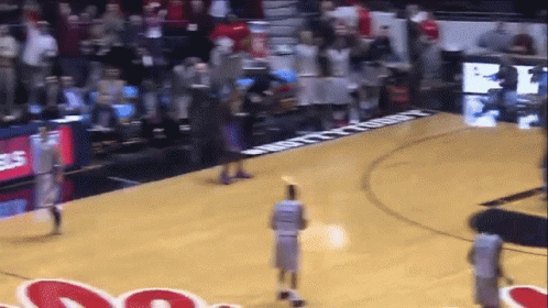 Basketball Game in Front of Gatorade Banner