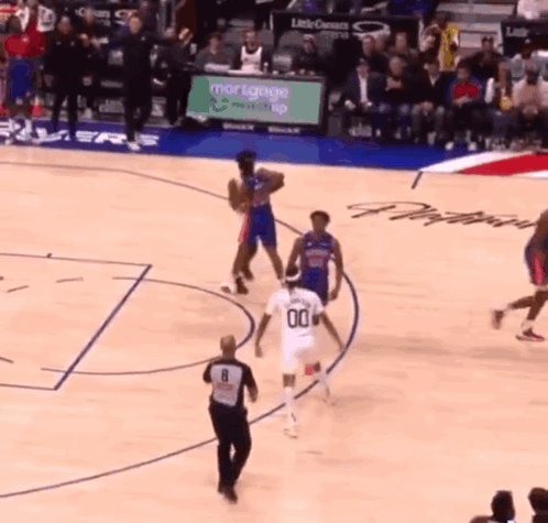 Basketball Game in Front of Mortgage Ad