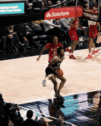 Basketball Game in Front of State Farm Sign