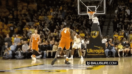Basketball Game in Front of Ukrops Ad