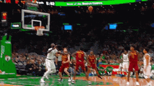 Basketball Game in Stadium With Scoreboard 5:52