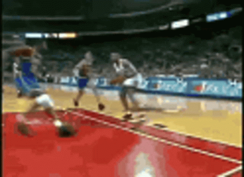 Basketball Game in Stadium With Sideline Ads