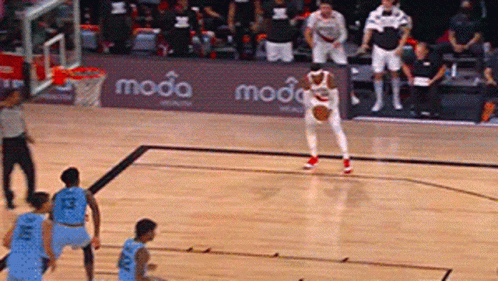 Basketball Game on Court With Moda Ad