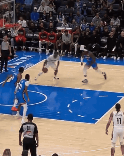 Basketball Game on Court With Oklahoma City Logo