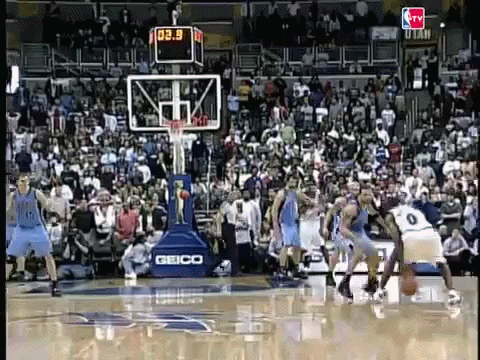 Basketball Game With Crowd and Geico Banner