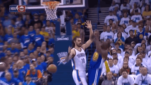 Basketball Game With NBA Sign and Crowd