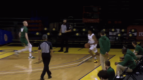 Basketball Game with Referee in Mask