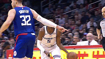 Basketball Player 32 Pointing at Another