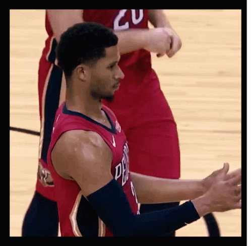 Basketball Player Clapping With Red Jersey Number 20