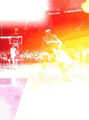 Basketball Player Dribbling Against Defender GIF