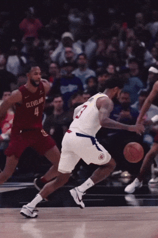 Basketball Player Dribbling Cleveland Uniform