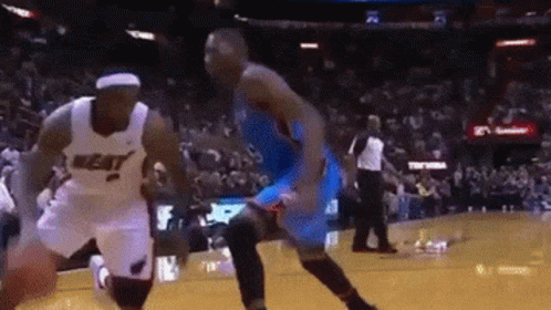 Basketball Player Dribbling Heat Jersey GIF