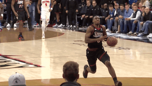 Basketball Player Dribbling Sixers Jersey