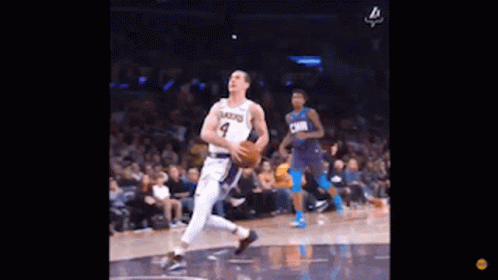 Basketball Player Dribbling While Another Watches
