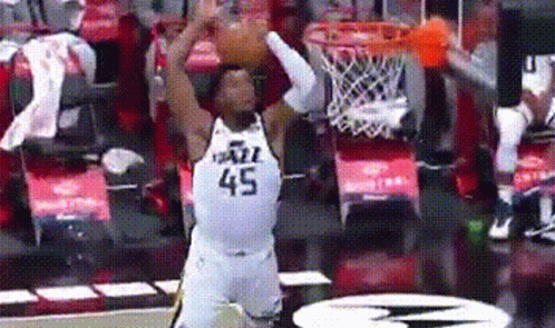 Basketball Player Dunking in White Jersey