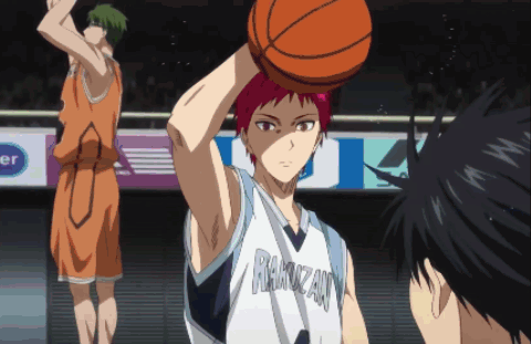 Basketball Player Holding Ball Above Head