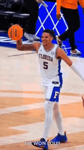 Basketball Player Holding Basketball Smiling
