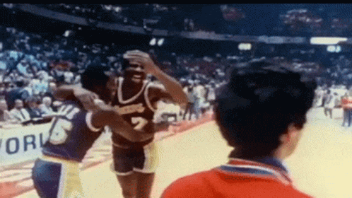 Basketball Player Hugging Number 7