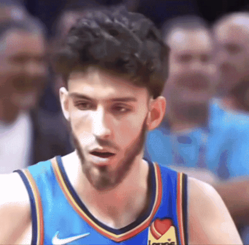 Basketball Player in Blue Jersey with Heart