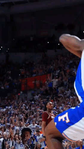 Basketball Player in Blue Jersey with Letter F