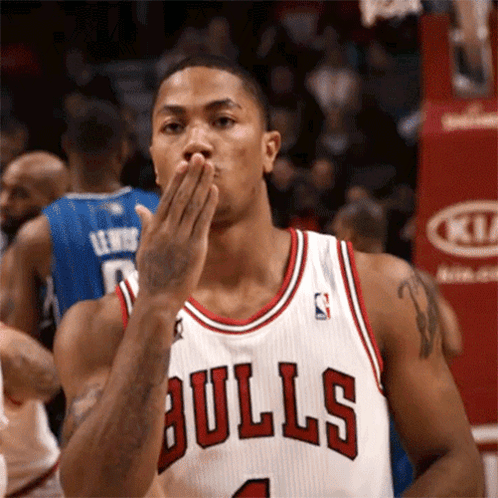 Basketball Player In Bulls Jersey Blowing A Kiss GIF