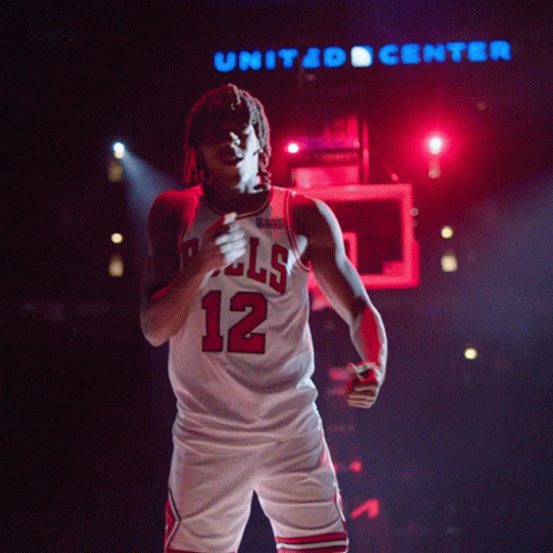 Basketball Player In Bulls Jersey Number 12 GIF