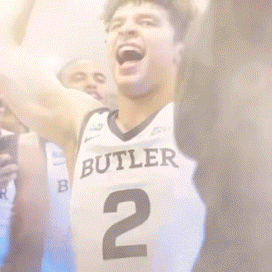 Basketball Player in Butler Jersey Number 2 Raising Arms