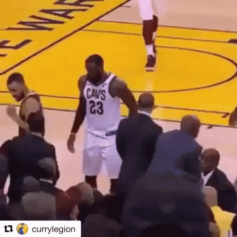Basketball Player in Cavs Jersey on Court With Crowd