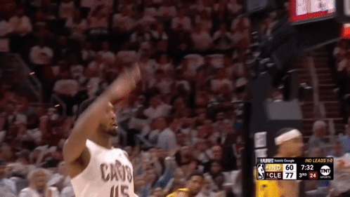 Basketball Player in Cavs Jersey Throwing Ball