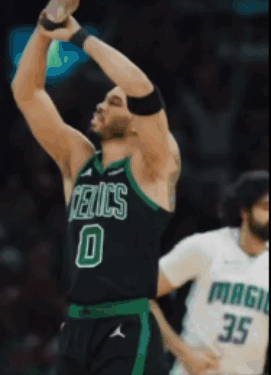 Basketball Player in Celtics Jersey Reaching for Ball